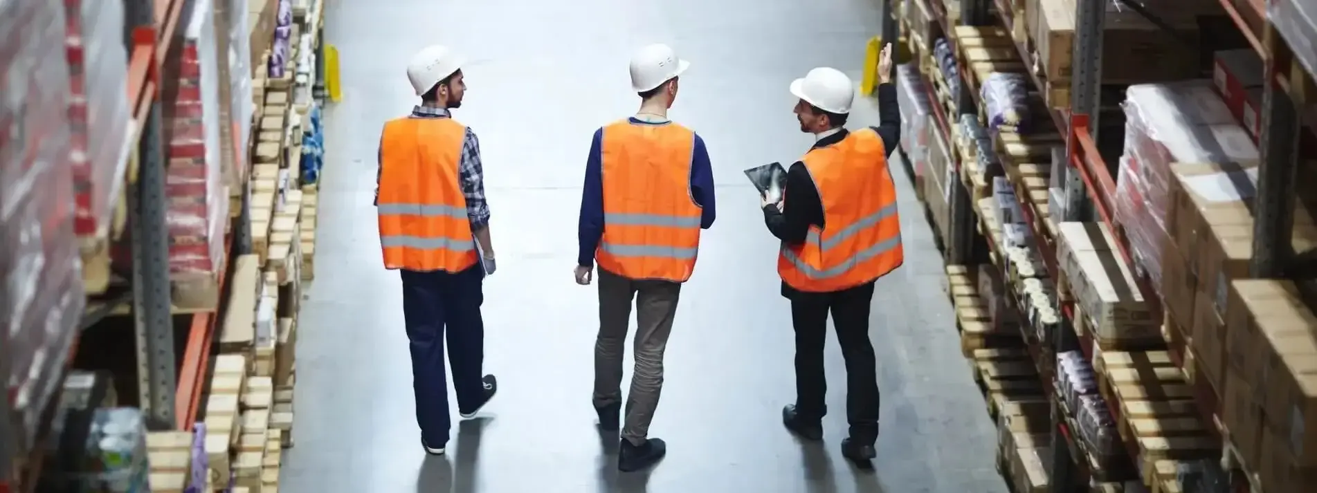 Workers implementing warehouse process flow techniques